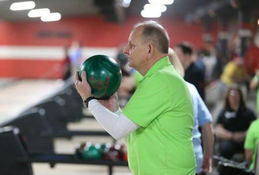 Athlete holding bowling ball