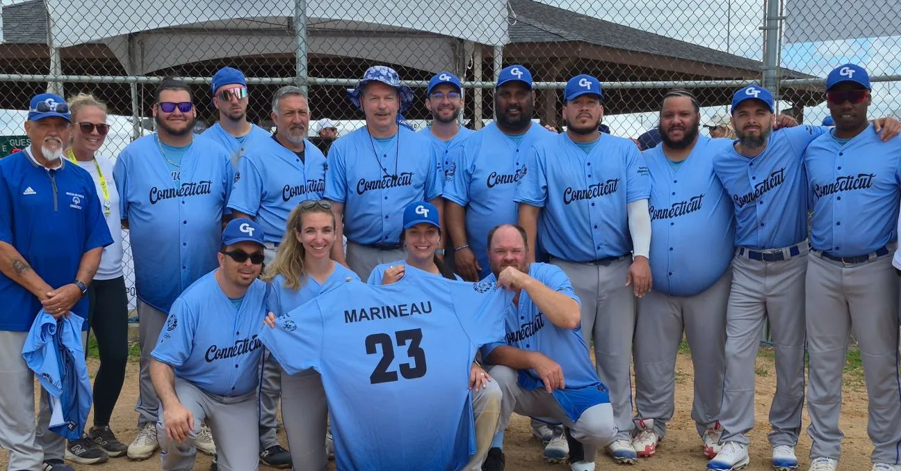 26USAGames Team CT softball holding Marineau jersey.jpg