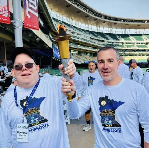 26 USA Games Ray & Bucky flame of hope.jpg