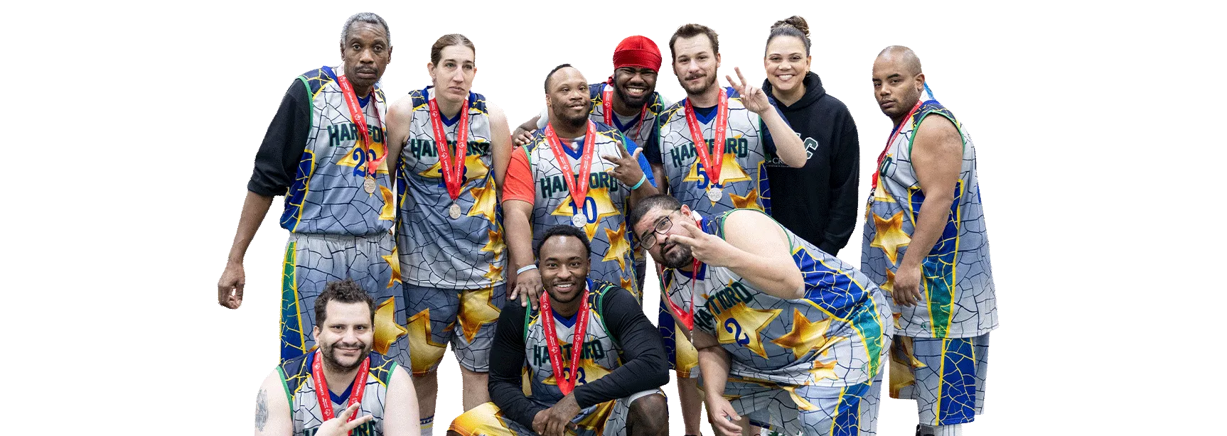 Men and women wearing face masks and hats standing together.